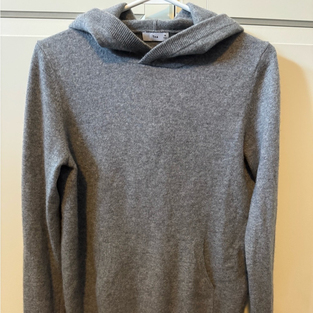TNA cashmere sweater/hoodie
Size Medium
Grey in colour